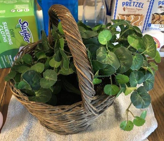 A clean artificial plant in a basket