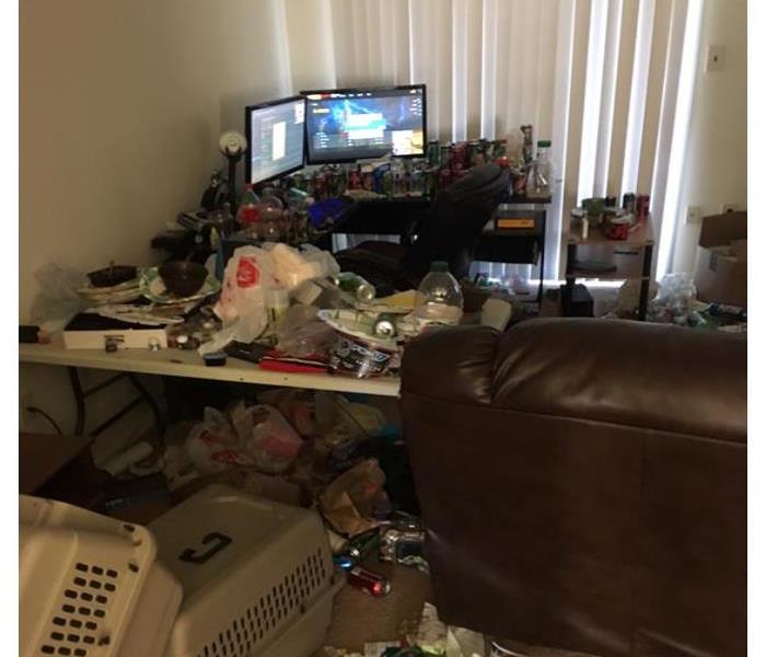 A messy living room filled with debris