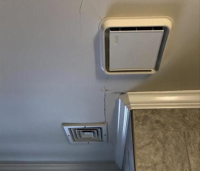 Cracks in a bathroom ceiling