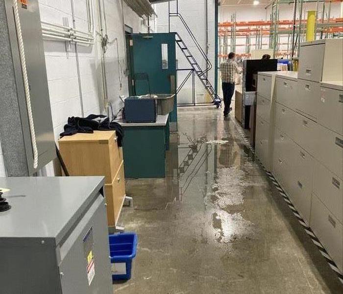 Wet floor in an aisle in a warehouse