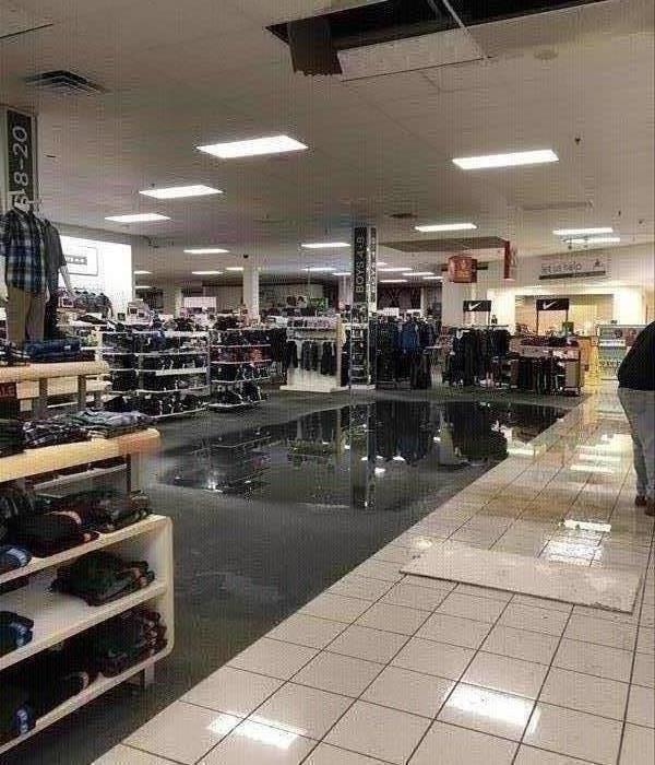 Large water puddle on carpet in department store