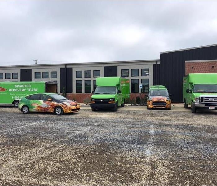 SERVPRO vehicles parked outside a commercial building